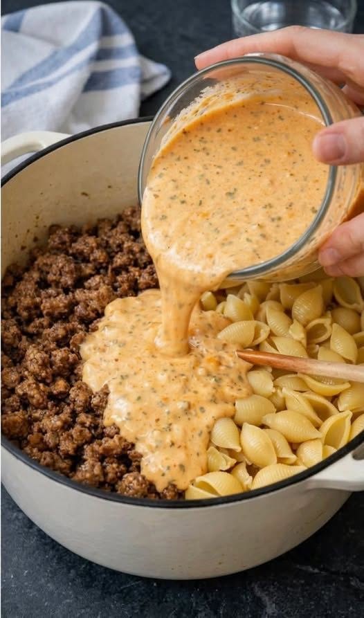 Pour this 1 creamy liquid over browned ground beef and uncooked pasta shells into a dutch oven for a one-pot dinner