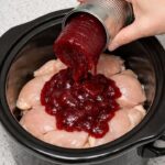 Dump canned cranberry sauce on top of chicken breasts, together with 1 ingredient
