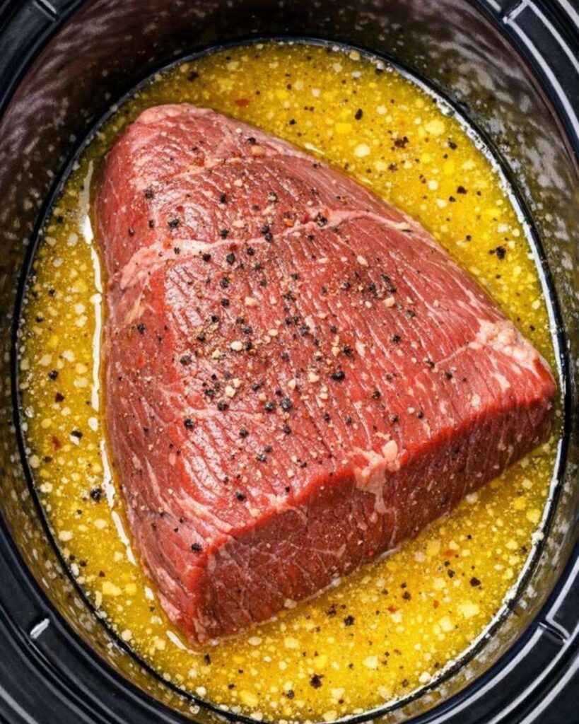 Dump a raw sirloin tip roast in the slow cooker alongside 4 more simple items