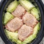 Throw raw cabbage wedges and chicken thighs in the slow cooker and add 3 simple ingredients